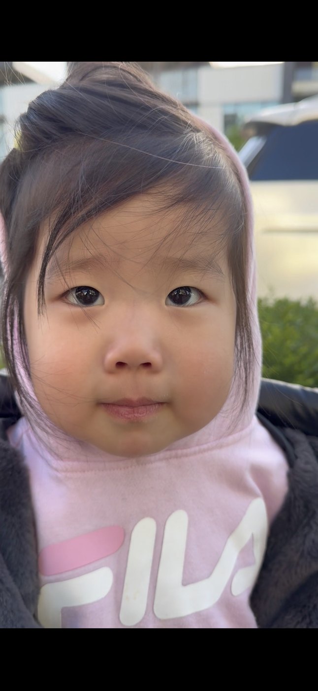 Taylor in her FILA hoodie